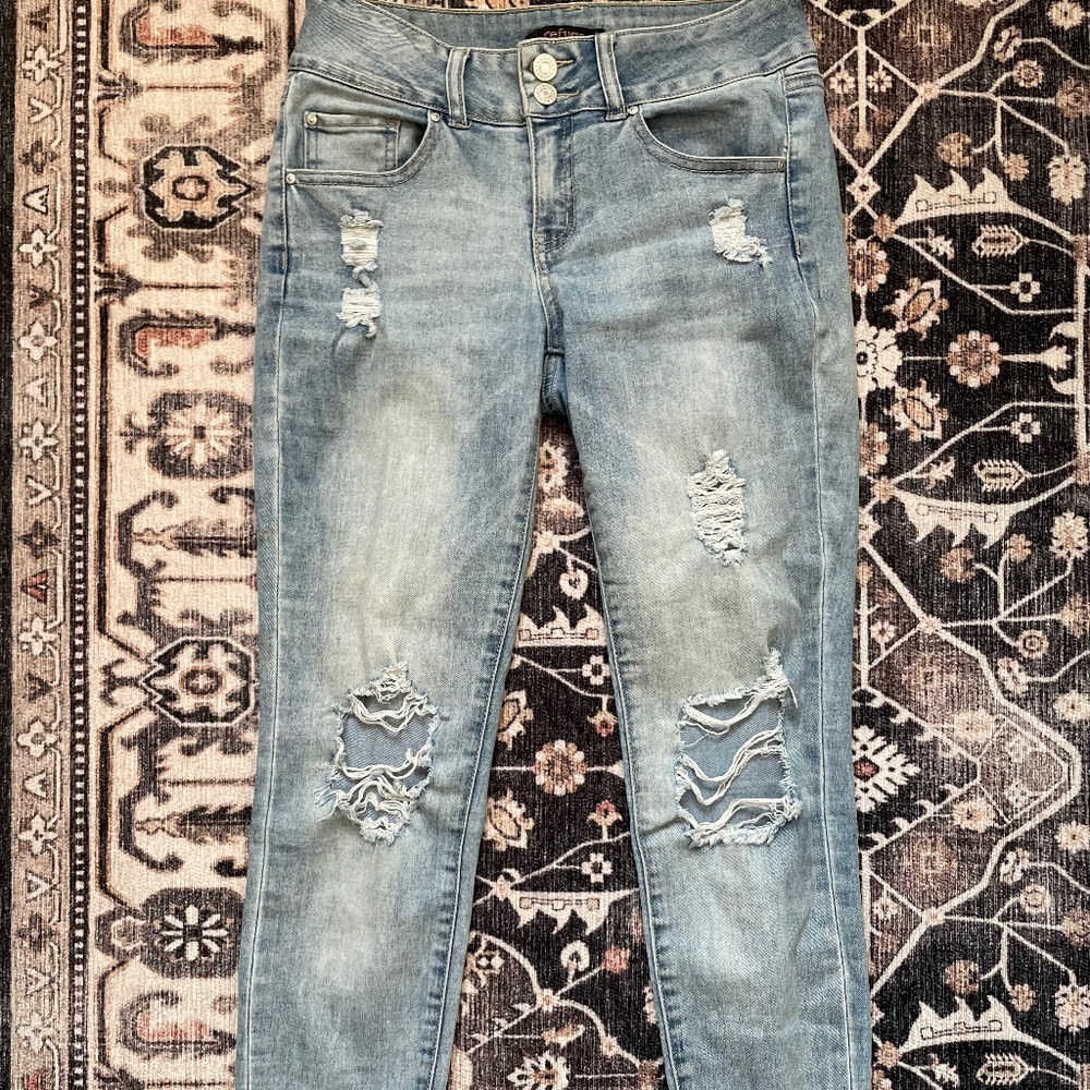 Distressed light wash skinny leg denim